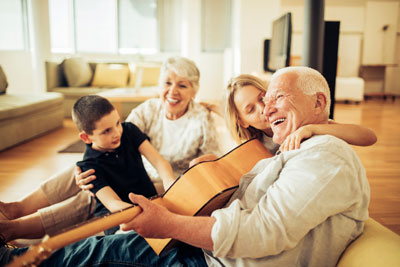 Family in living room singing songs.